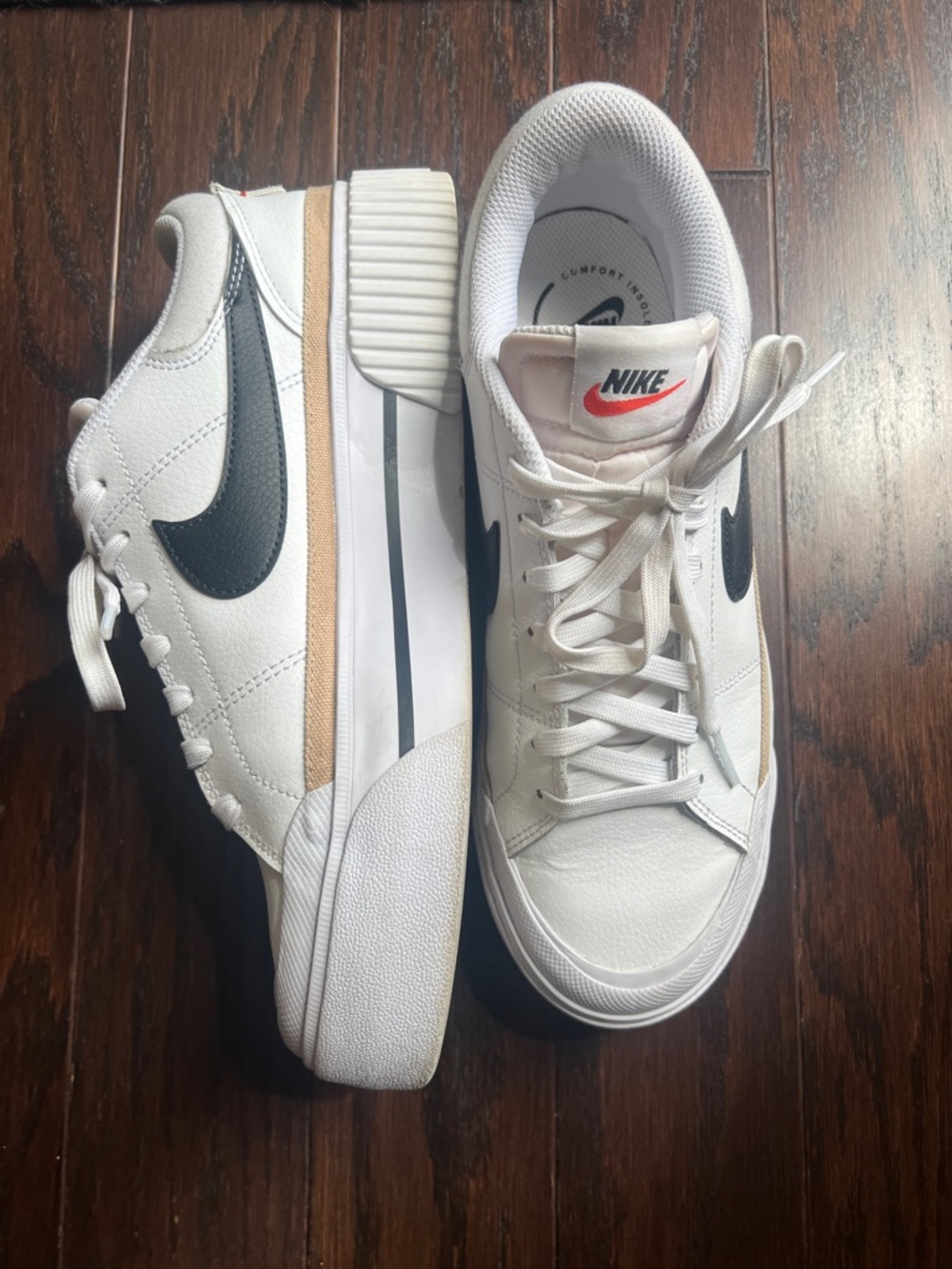 Nike White Sneakers with Black Swoosh and Tan Accent